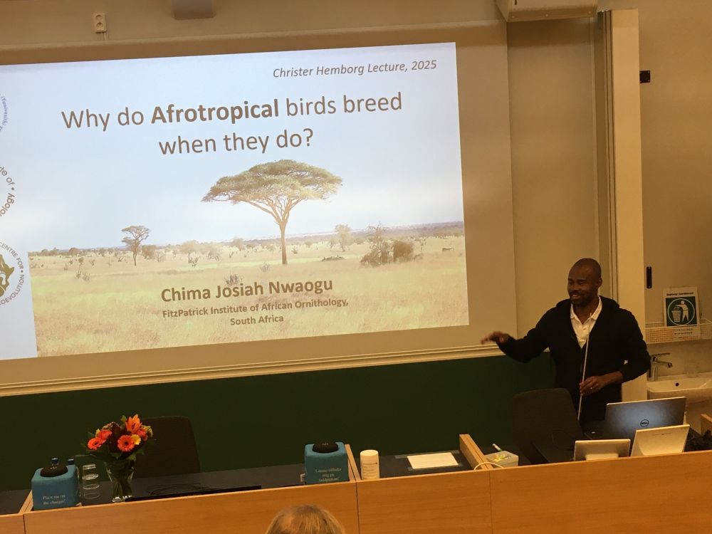 Dr Chima Nwaogu starting his talk, with the title slide showing landscape and vegetation in Africa