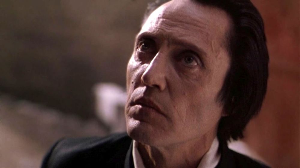 Gabriel (Christopher Walken) looks upward while standing in an alley in The Prophecy (1995)
