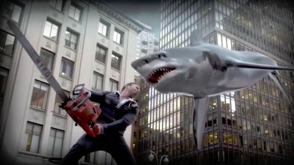 Fin (Ian Ziering) wields a chainsaw against a flying shark in a downtown area in Sharknado (2013)