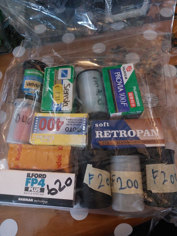 A zip lock bag full of 35mm and 120 film