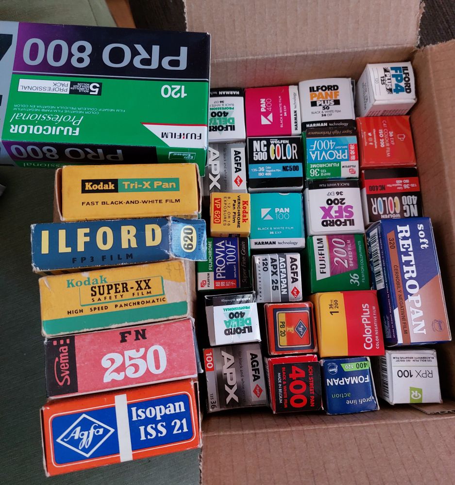 A big ol' pile of empty 35mm and medium format film boxes. 