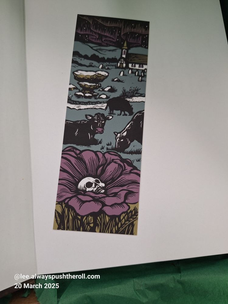 Image shows the bookmark 'addon' that was available.
In the distance is a church, the graveyard gives way to a field in which cows appear to be grazing. One cow seems to be looking directly at the viewer.
The main focus of the art is a flower with purple petals around a white skull in the centre. 