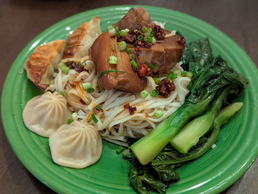Taiwanese style braised pork hock with steamed Chinese broccoli, pork and shrimp soup dumplings, gyoza. A very hearty meal