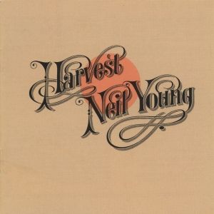 Neil Young Harvest album cover. Black text over a peach colored dot on a beige surface.