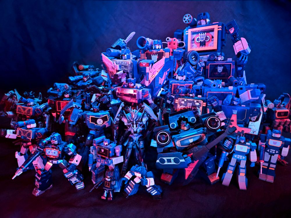 A mountain of Soundwave toys from across the franchise's history from G1 to Lego