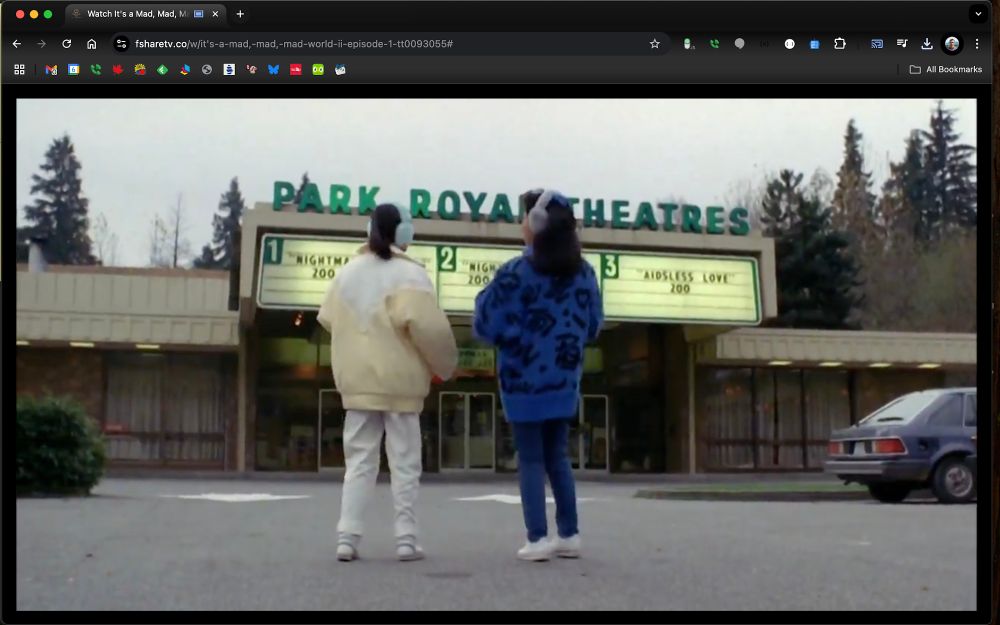 Screenshot from It's a Mad Mad Mad Mad World 2 of the Park Royal Theatre with a superfluous AIDS joke on the marquee. Ouch.