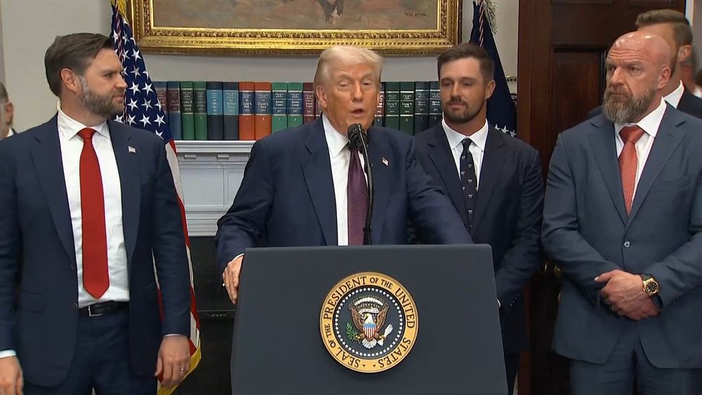 Triple H standing alongside Trump and Vance at an official Whitehouse presser. 