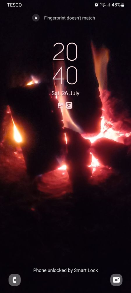 My phone lock screen; video of a campfire