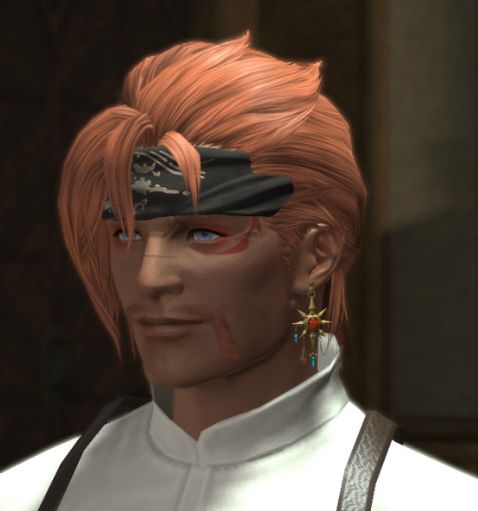 The same man but with longer hair, he is in a 3/4 profile with a neutral smile.