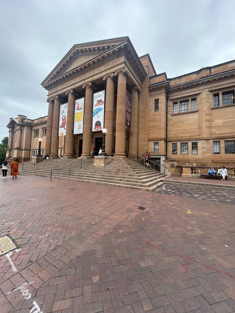 The state library facade. It is a big sand stone building with a two lane slip road right outside. Apparently they are reducing that road so the library can have a nice forecourt 