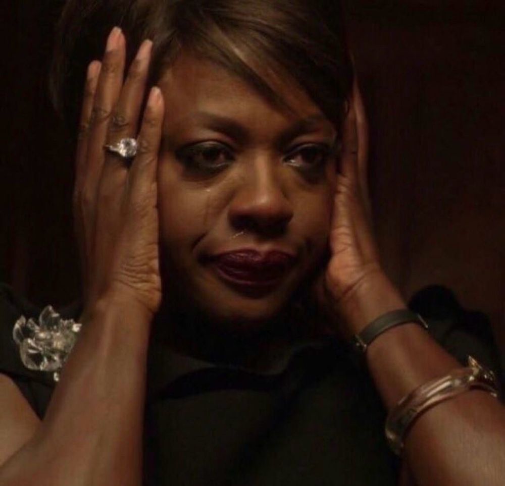 scene from show “How To Get Away With Murder” showing close up of main character Annalise Keating played by Viola Davis with her hands against her ears, tears flowing, and a distressed look on her face