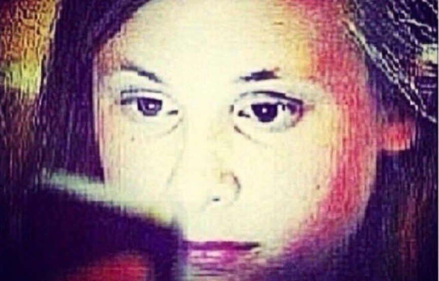 Lady staring at phone deep fried