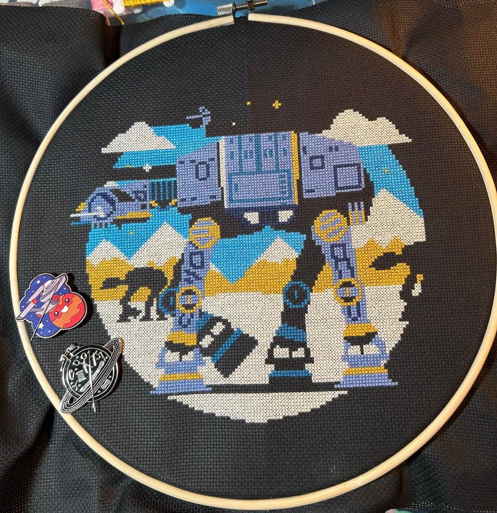 Incomplete cross stitch of stylized AT-AT from Star Wars.  Original art by DKNG Studio