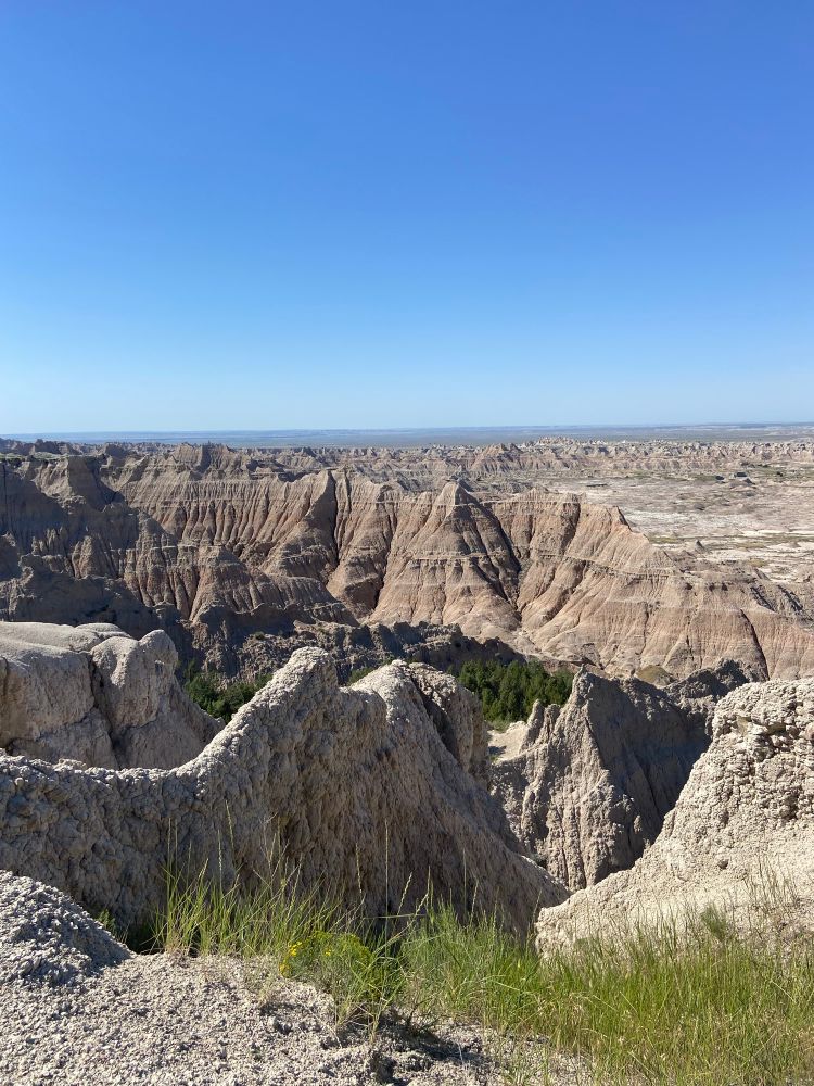 Pinnacles at Badlands National Park.  Dry landscape with canyon-like formations showing many geologic layers