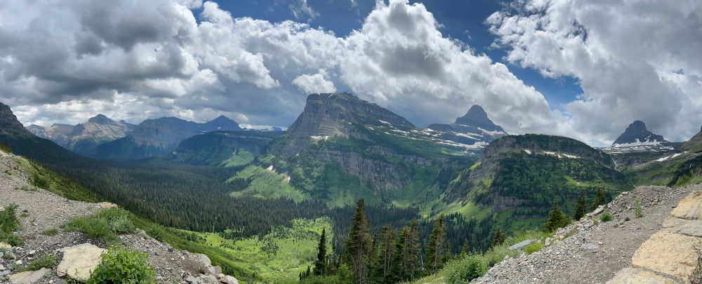 Panoramic photo of Glacier National Park mountains and valley.  