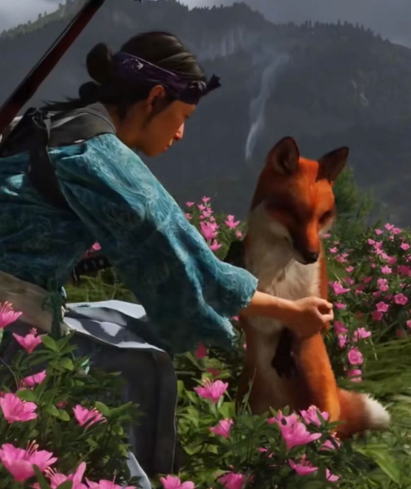 Atsu from Ghost of Yotei kneels down and reaches out to pet a curious-looking red fox
