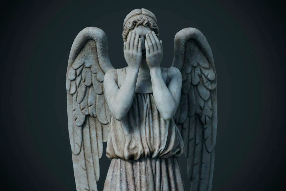 stone angel with wings covering eyes, dark grey backdrop