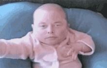Meme of a newborn baby bringing its hand to its chin, but the baby's face is overlaid with Musk's