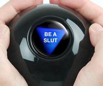 A magic eight ball being held by someone’s hands saying be a slut 