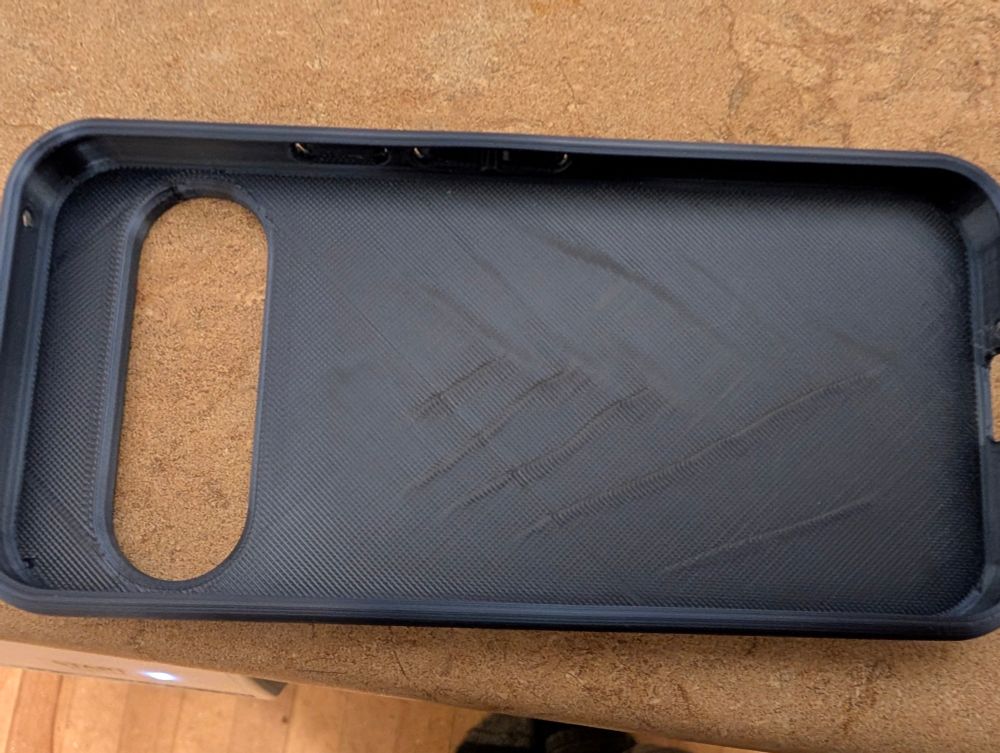 The inside of a Pixel 9 case, showing artifacts from poor print settings.